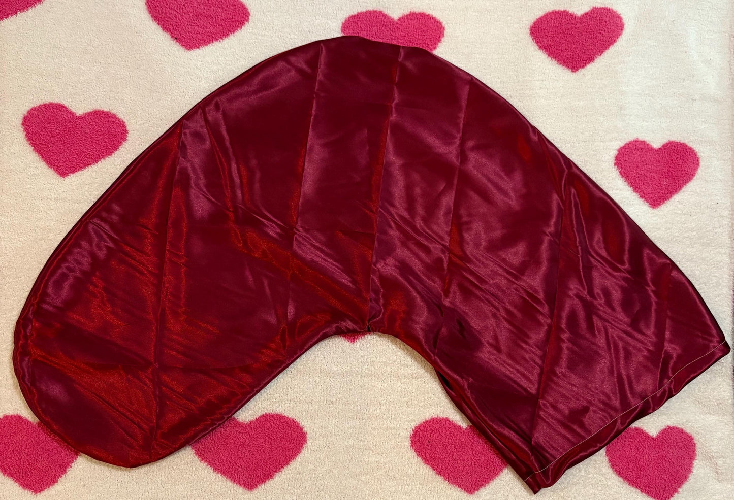 Handmade V-shaped pillowcase in a variety of stylish prints, crafted from soft polyester with a silk satin feel, designed to protect hair and enhance sleep comfort. Pillow not included.