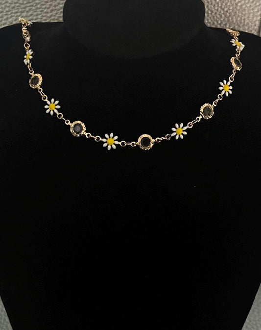 Gold Daisy Chain Necklace featuring charming floral links, ideal for adding a touch of elegance to any outfit, perfect for spring and summer styling.