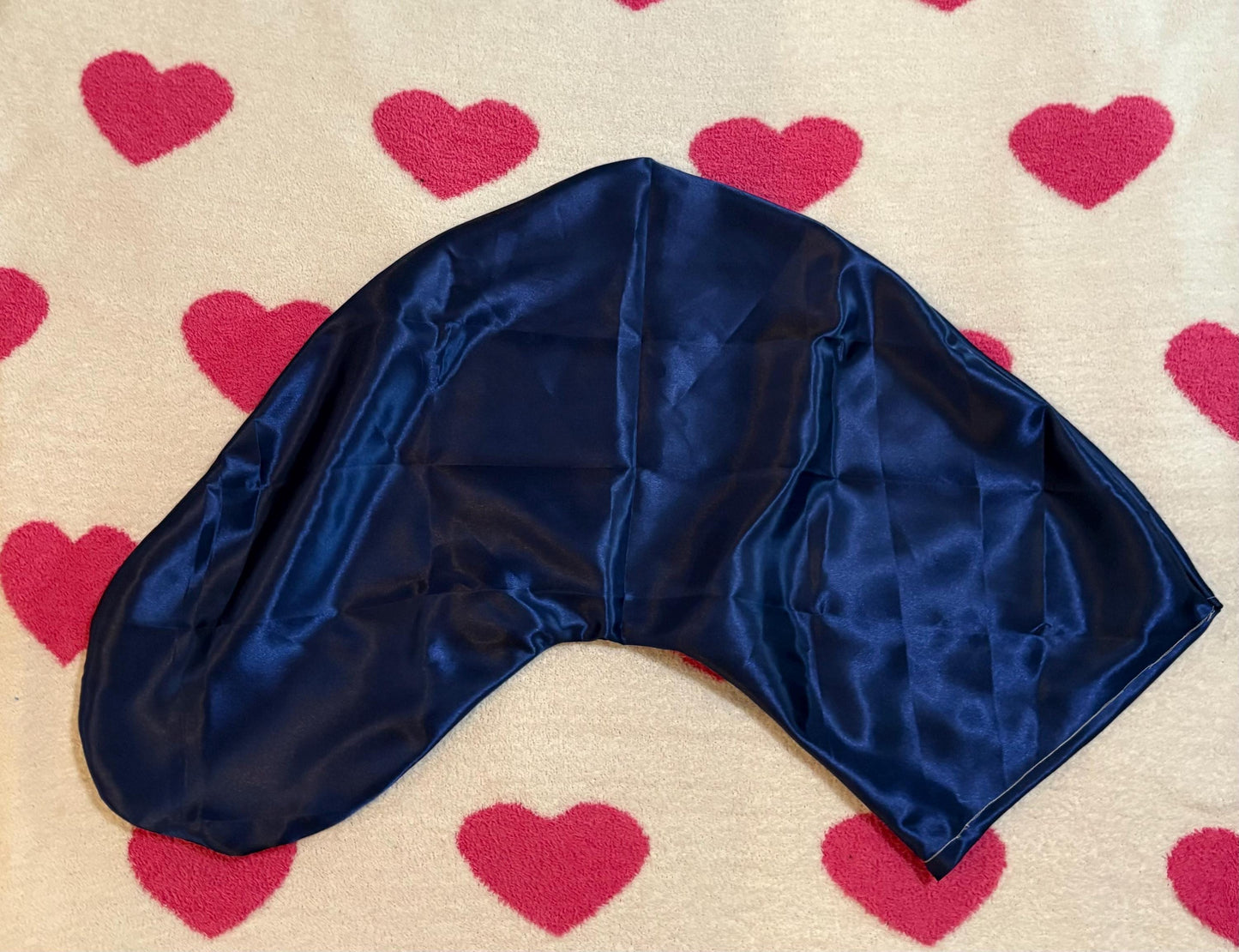 Handmade V-shaped pillowcase in a variety of stylish prints, crafted from soft polyester with a silk satin feel, designed to protect hair and enhance sleep comfort. Pillow not included.