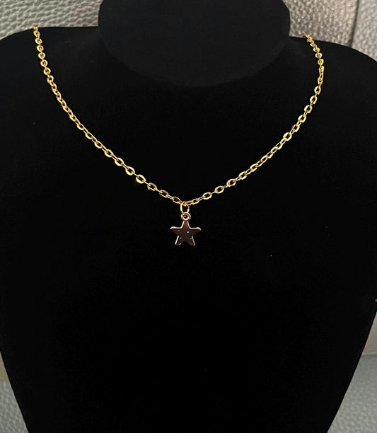 Gold Star Pendant Necklace featuring a delicate design, perfect for adding a touch of elegance and charm to any outfit, ideal for layering or wearing alone.