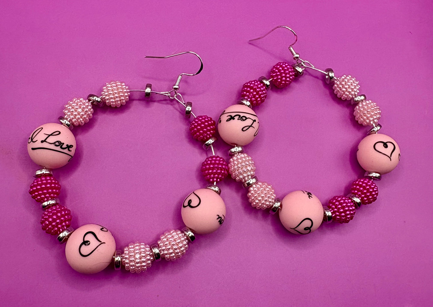 Charming handmade beaded hoop earrings featuring the phrase 'I Love You' in a unique design, perfect for expressing love and adding a personal touch to any outfit, ideal for gifts and special occasions.