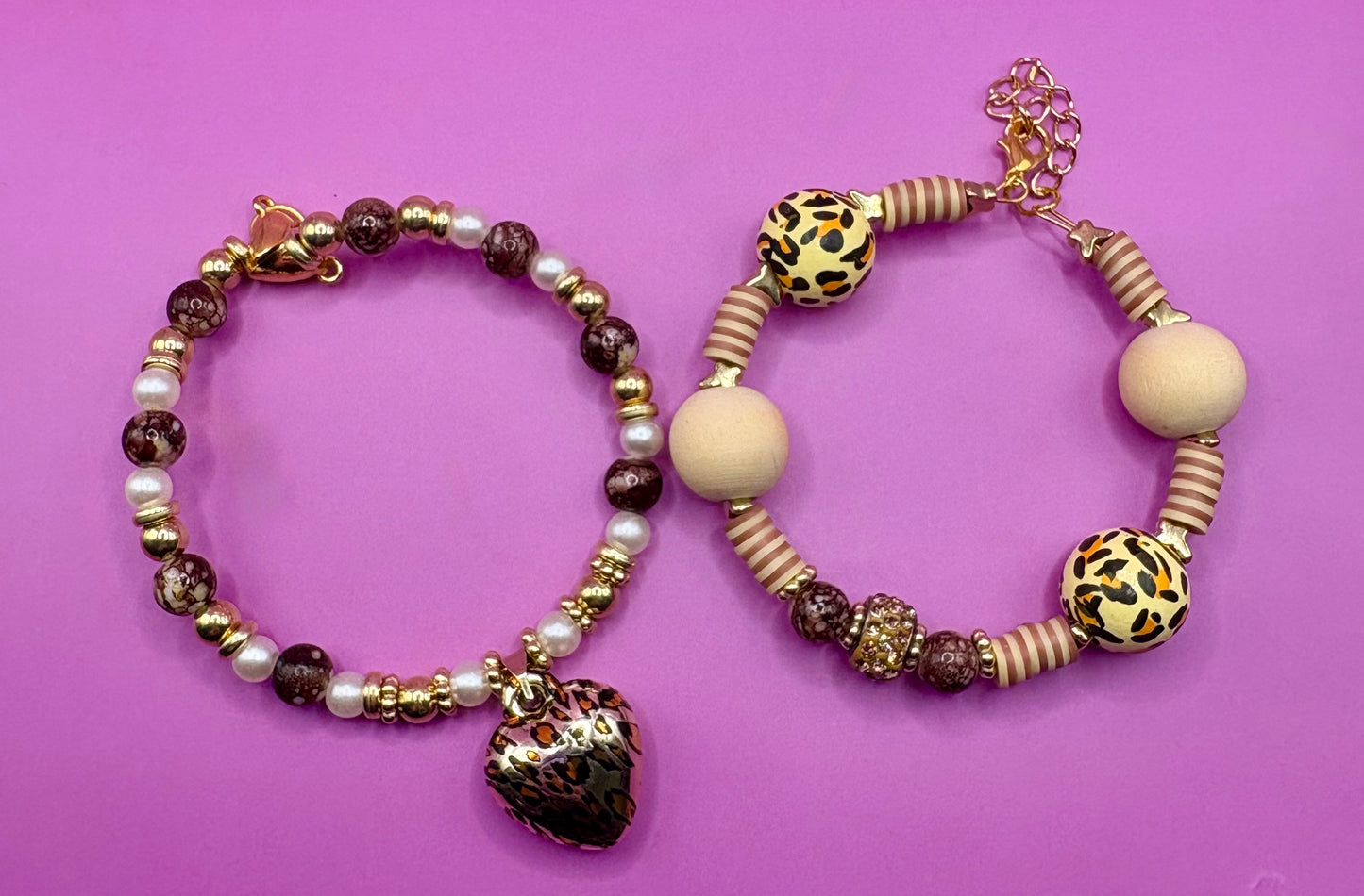 Handmade beaded charm bracelets stacked together, showcasing unique designs and vibrant colors, perfect for adding a personalized touch to any jewelry collection. tan brown leopard print animal print heart pendant