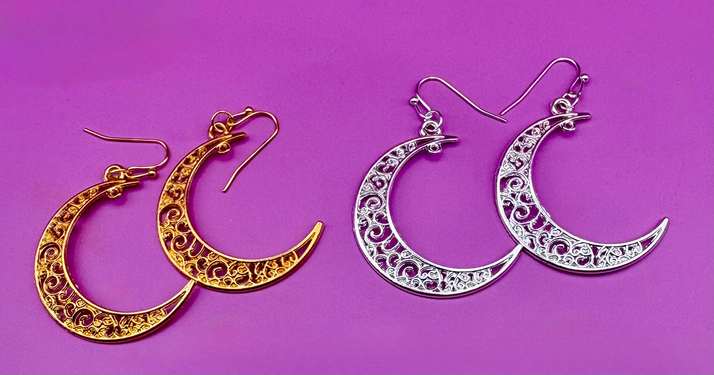 Stylish large moon earrings in gold and silver, perfect for adding a celestial touch to your jewelry collection and complementing any outfit.