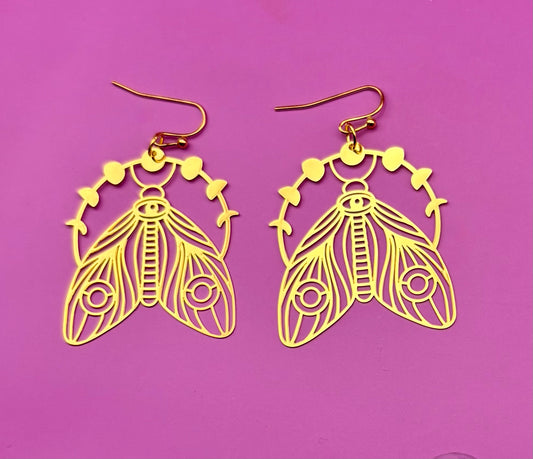 Elegant gold moth dangly earrings, featuring intricate design and lightweight construction, perfect for adding a unique touch to any outfit.
