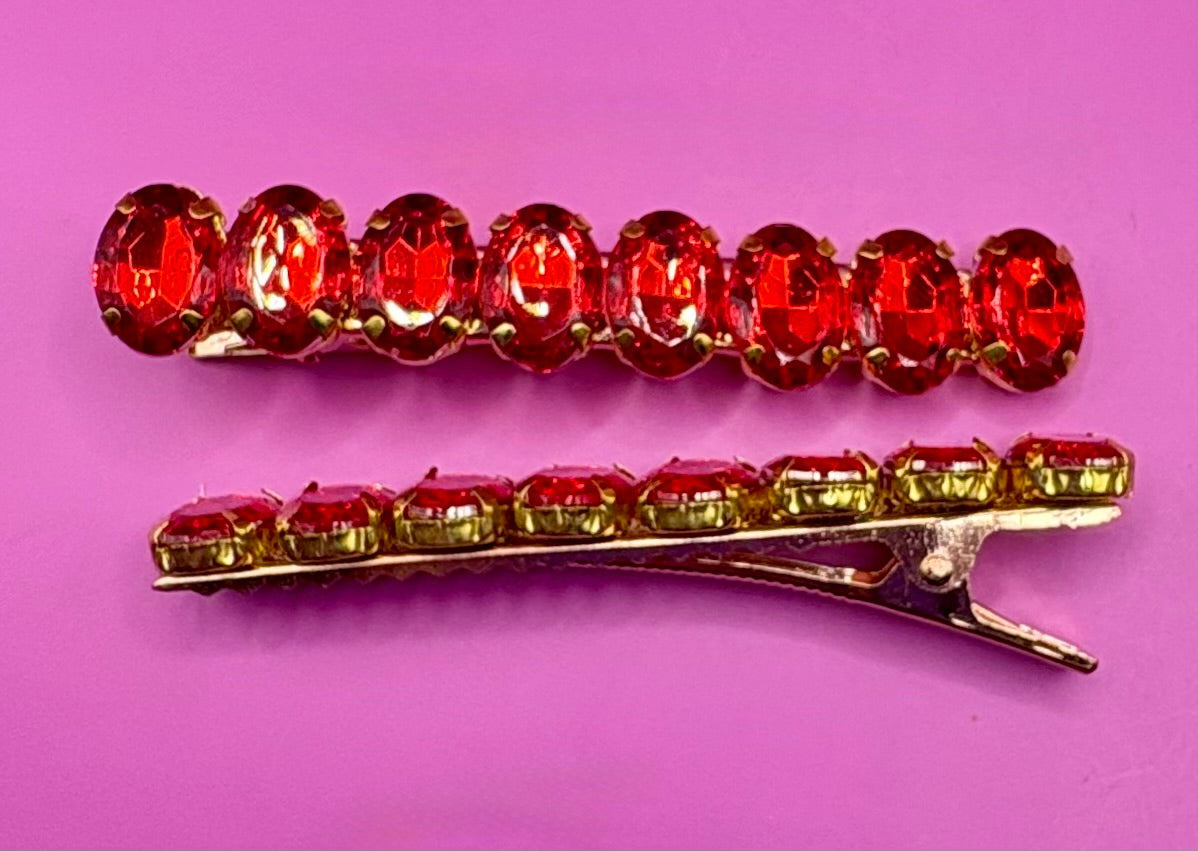 Stylish pair of large gemstone hair slides in vibrant colors, perfect for adding a fashionable touch to any hairstyle and enhancing your look.