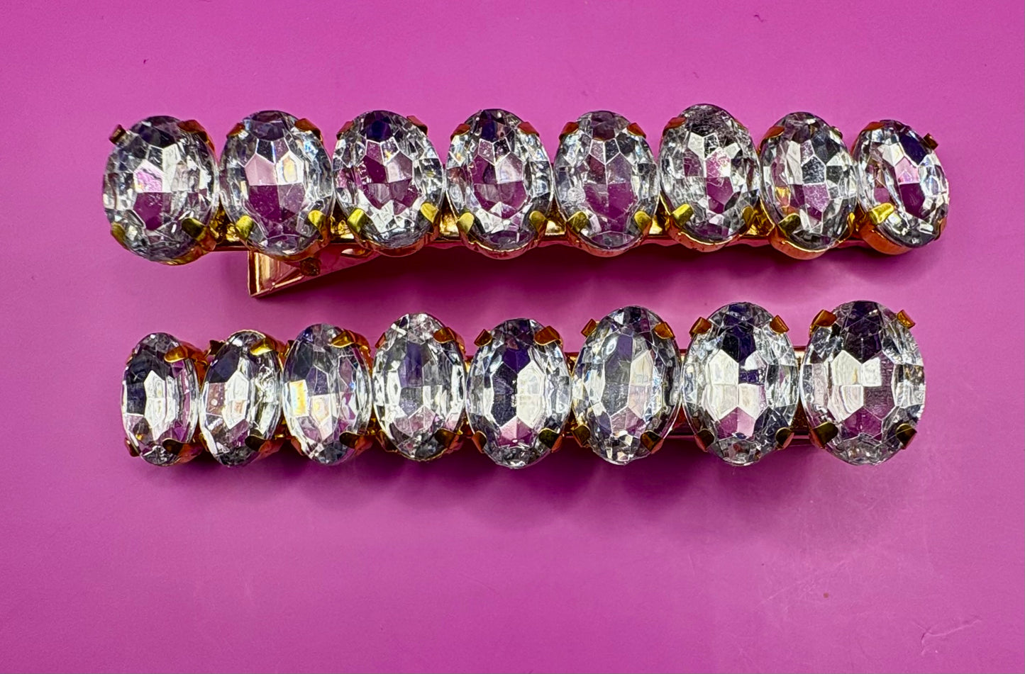 Stylish pair of large gemstone hair slides in vibrant colors, perfect for adding a fashionable touch to any hairstyle and enhancing your look.