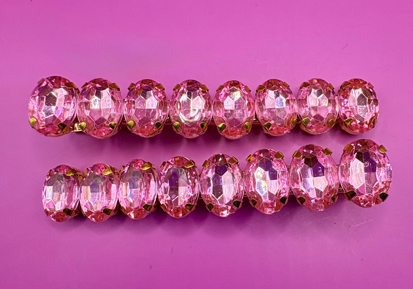 Stylish pair of large gemstone hair slides in vibrant colors, perfect for adding a fashionable touch to any hairstyle and enhancing your look.