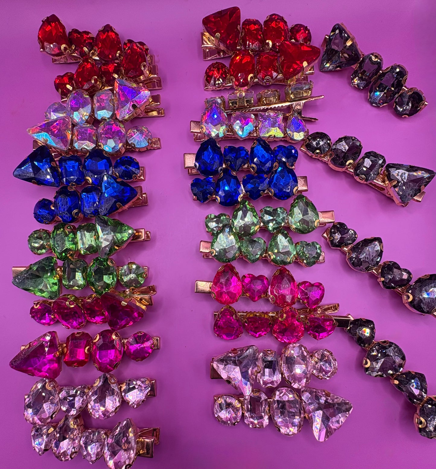 Elegant pair of pink and purple gemstone hair slides, ideal for enhancing your hairstyle with a touch of glamour and color.