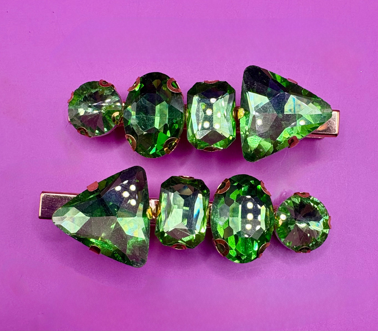 Elegant pair of pink and purple gemstone hair slides, ideal for enhancing your hairstyle with a touch of glamour and color.