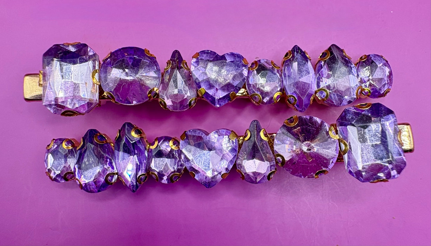Stylish pair of large gemstone hair slides featuring vibrant colors, perfect for adding a chic and fashionable touch to any hairstyle.