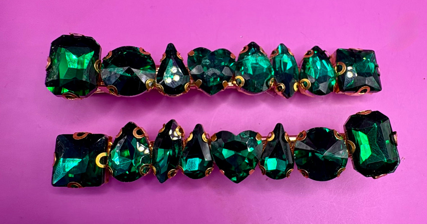 Stylish pair of large gemstone hair slides featuring vibrant colors, perfect for adding a chic and fashionable touch to any hairstyle.