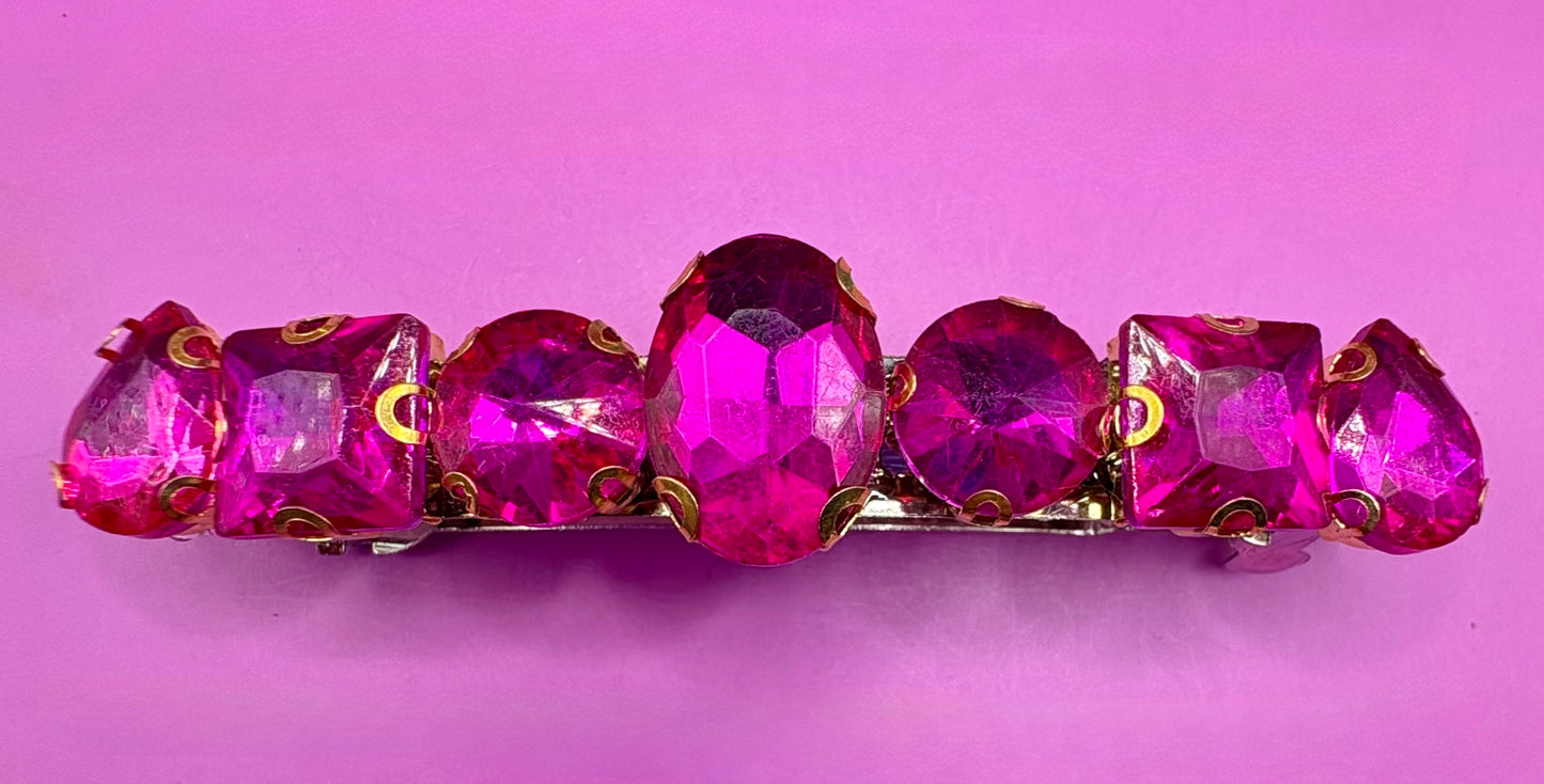 Eye-catching glass rhinestone statement prong clip for hair, perfect for elevating your hairstyle with glamorous sparkle and shine.