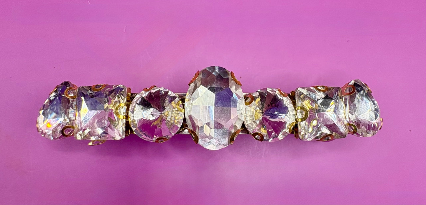 Eye-catching glass rhinestone statement prong clip for hair, perfect for elevating your hairstyle with glamorous sparkle and shine.