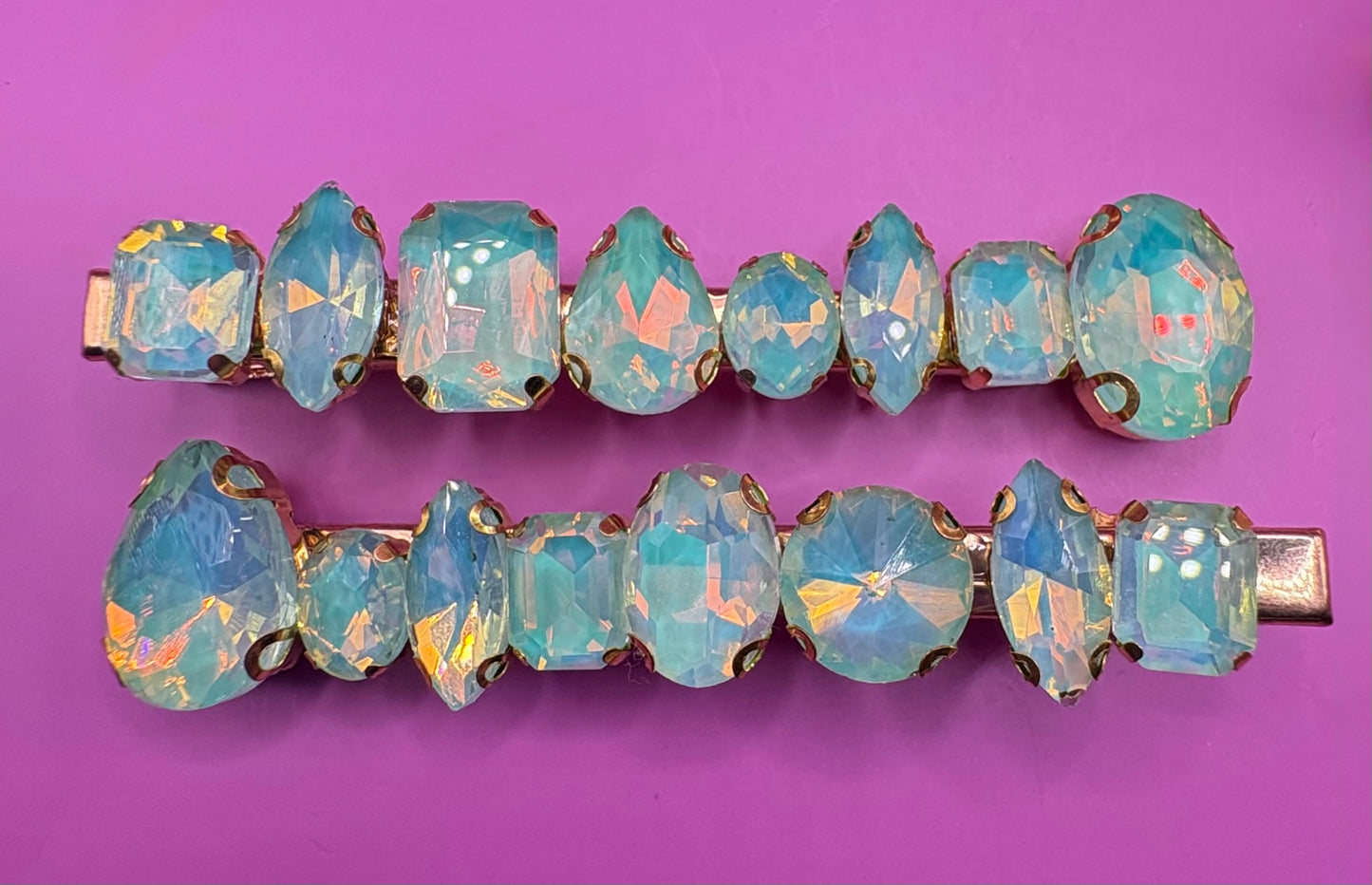 Stylish pair of large neon pastel gemstone hair slides designed for fashion-forward hairstyles, perfect for adding a statement touch to any look.