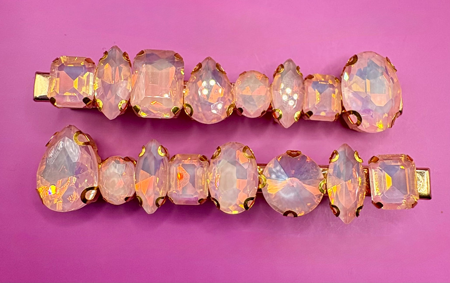 Stylish pair of large neon pastel gemstone hair slides designed for fashion-forward hairstyles, perfect for adding a statement touch to any look.