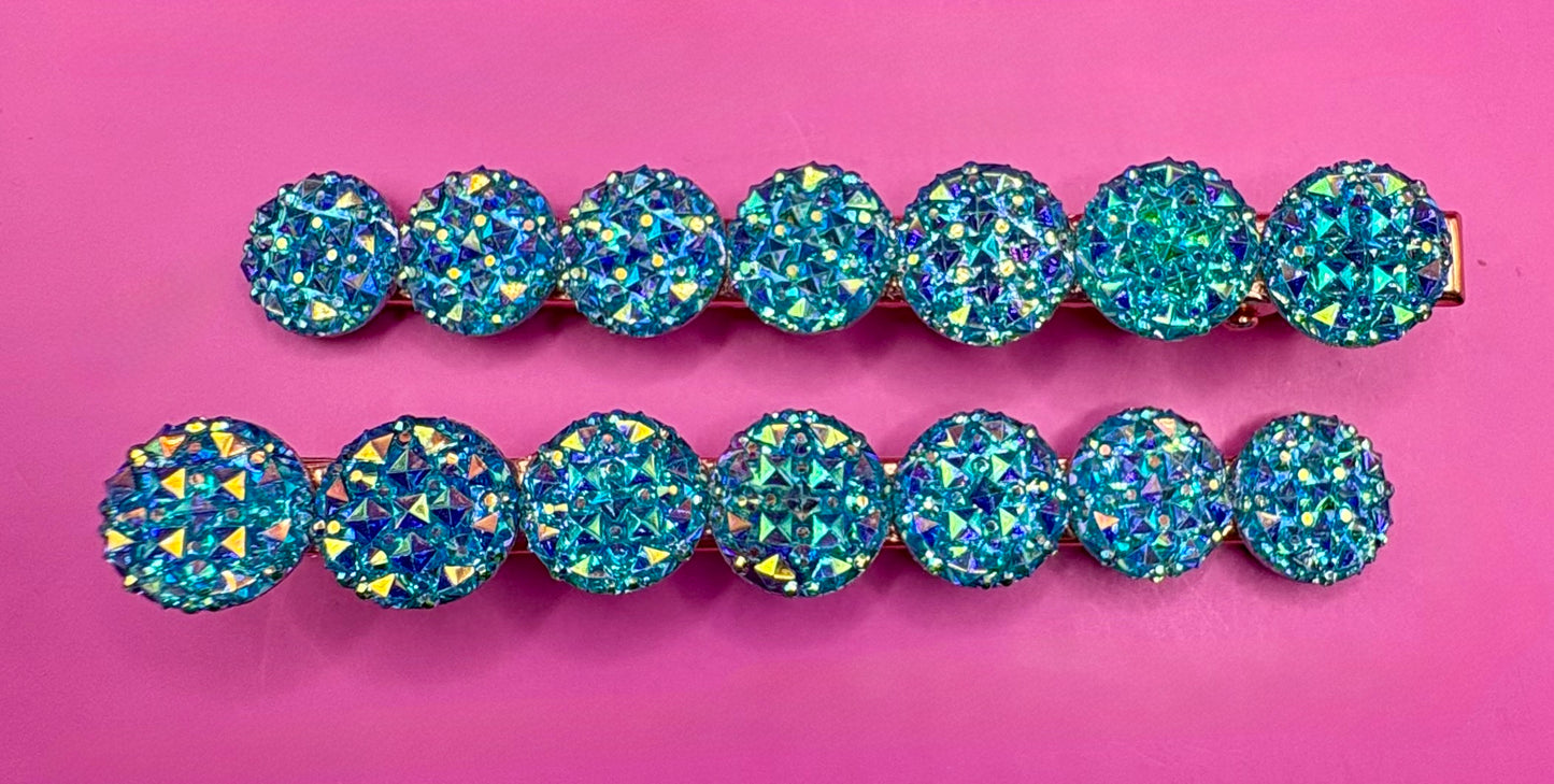 Chic large circular glitter heart hair clips, featuring a sparkly design and sold as a pair, ideal for Valentine's Day gifts and enhancing any hairstyle with a touch of glamour. available in multi colour, gold, turquois pink silver purple