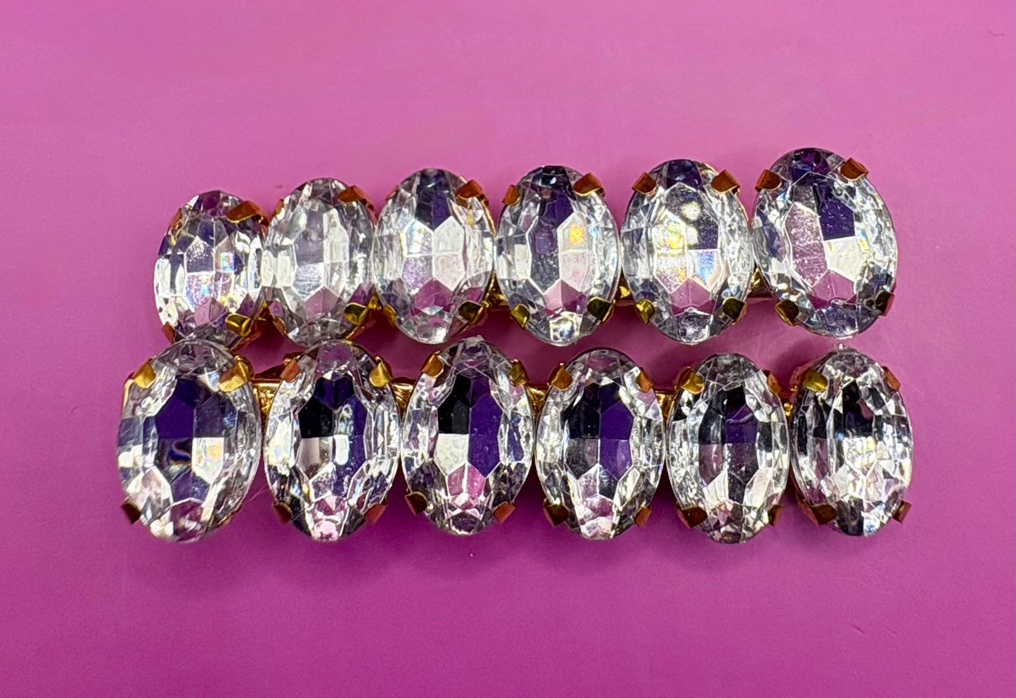 Elegant pair of 6cm gemstone hair slides featuring unique designs, ideal for enhancing hairstyles and adding a touch of glamour to any outfit.