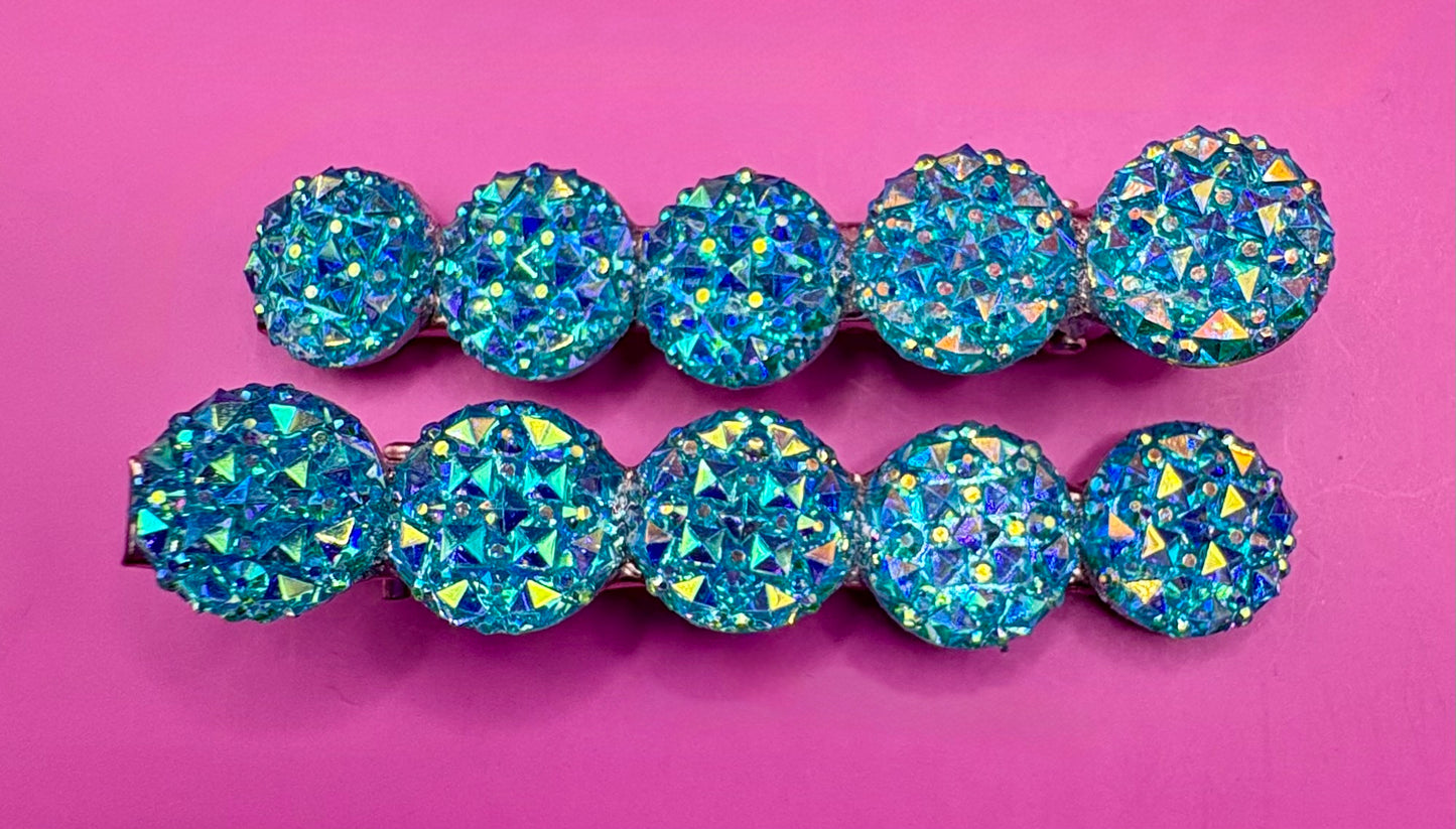 Chic circular glitter heart hair clips, featuring a sparkly design and sold as a pair, ideal for Valentine's Day gifts and enhancing any hairstyle with a touch of glamour. available in multi colour, gold, turquois pink silver purple