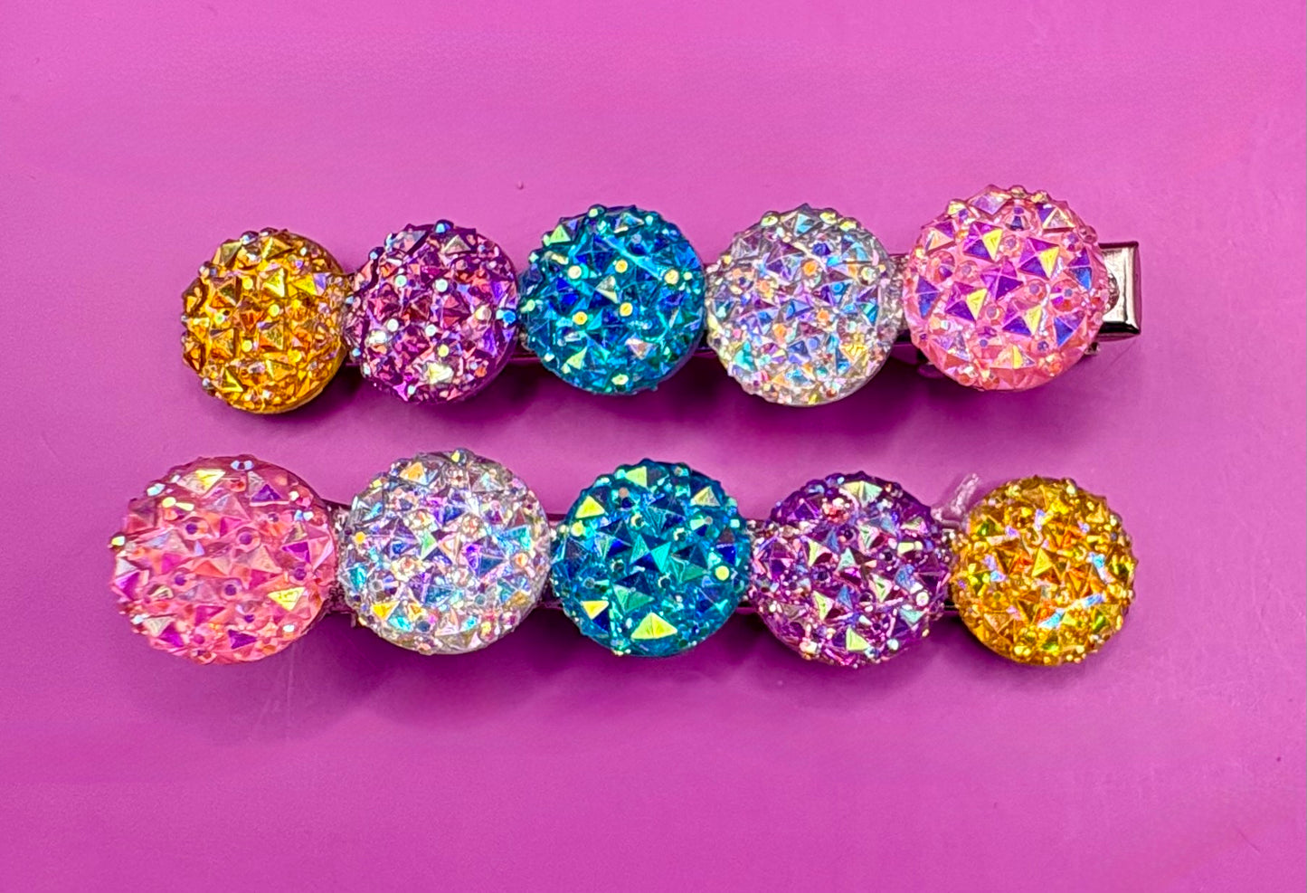 Chic circular glitter heart hair clips, featuring a sparkly design and sold as a pair, ideal for Valentine's Day gifts and enhancing any hairstyle with a touch of glamour. available in multi colour, gold, turquois pink silver purple