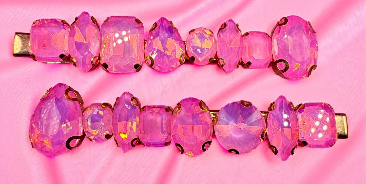 Pink gemstone hair clips on a pink background