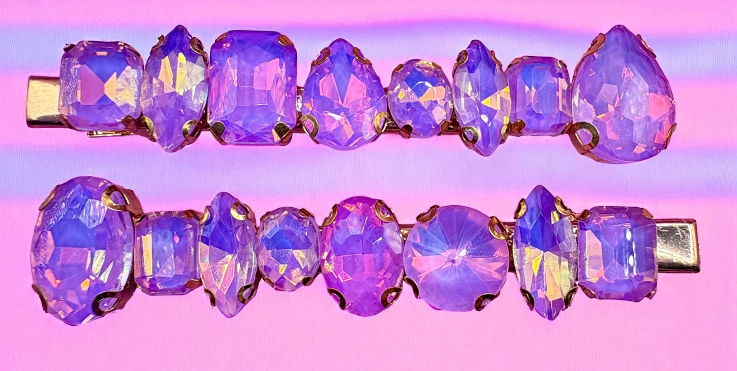 Purple crystal hair clip on a gradient pink and purple background