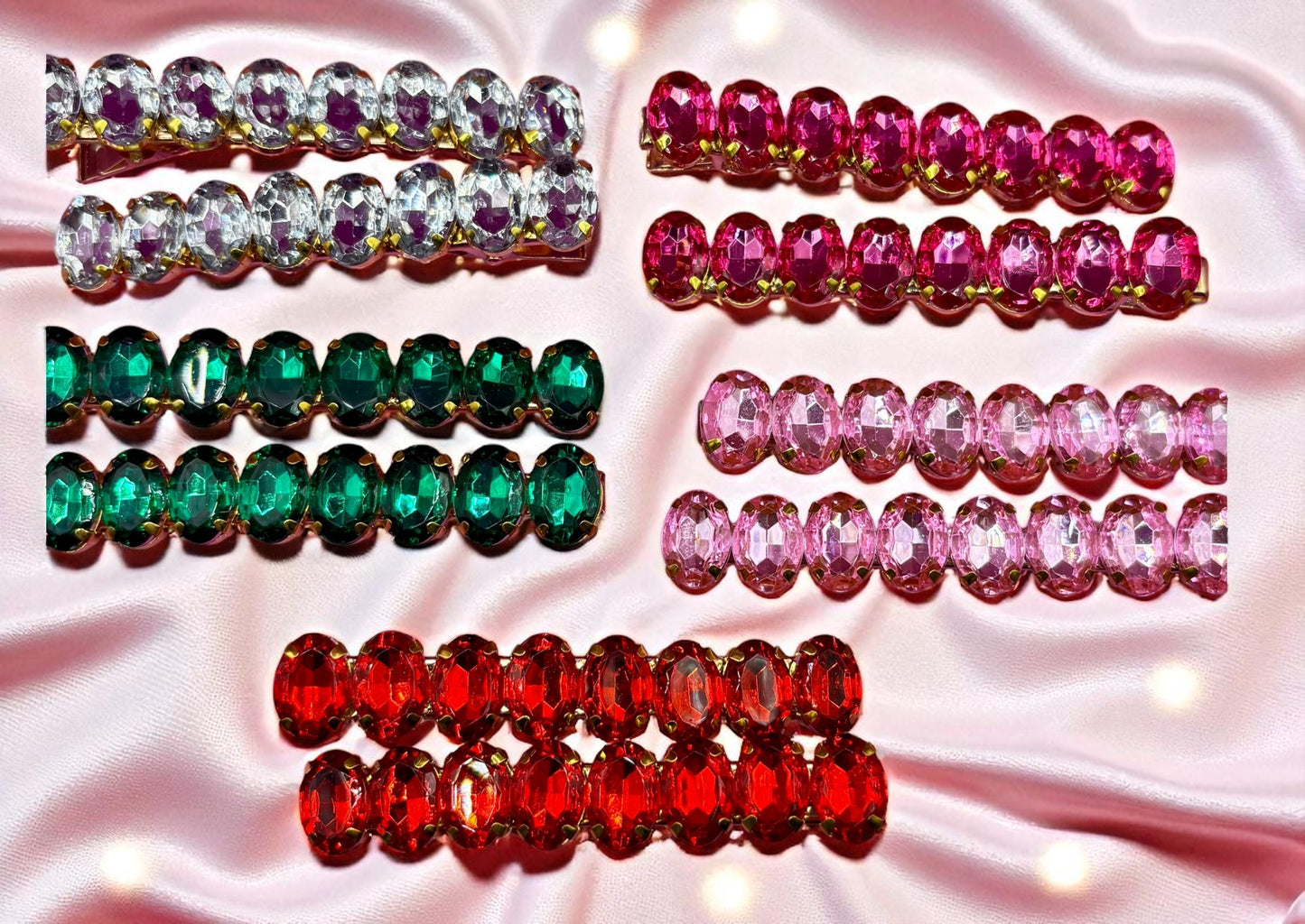 Set of colorful gemstone hair clips on a pink satin background