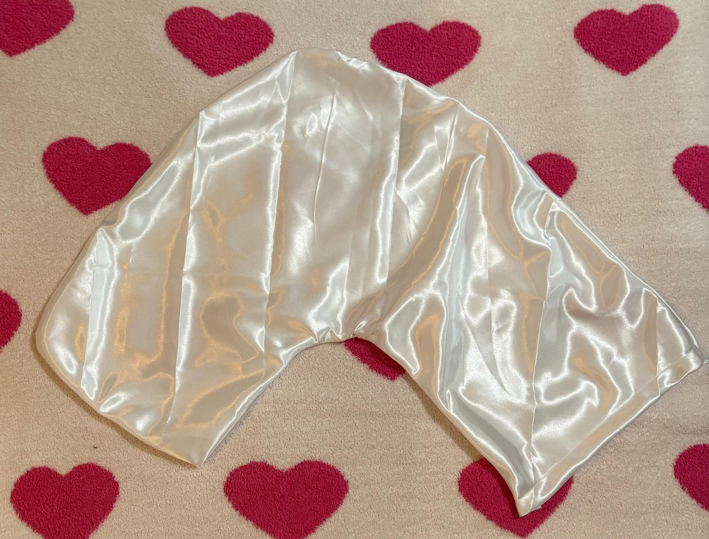 Handmade V-shaped pillowcase in a variety of stylish prints, crafted from soft polyester with a silk satin feel, designed to protect hair and enhance sleep comfort. Pillow not included.