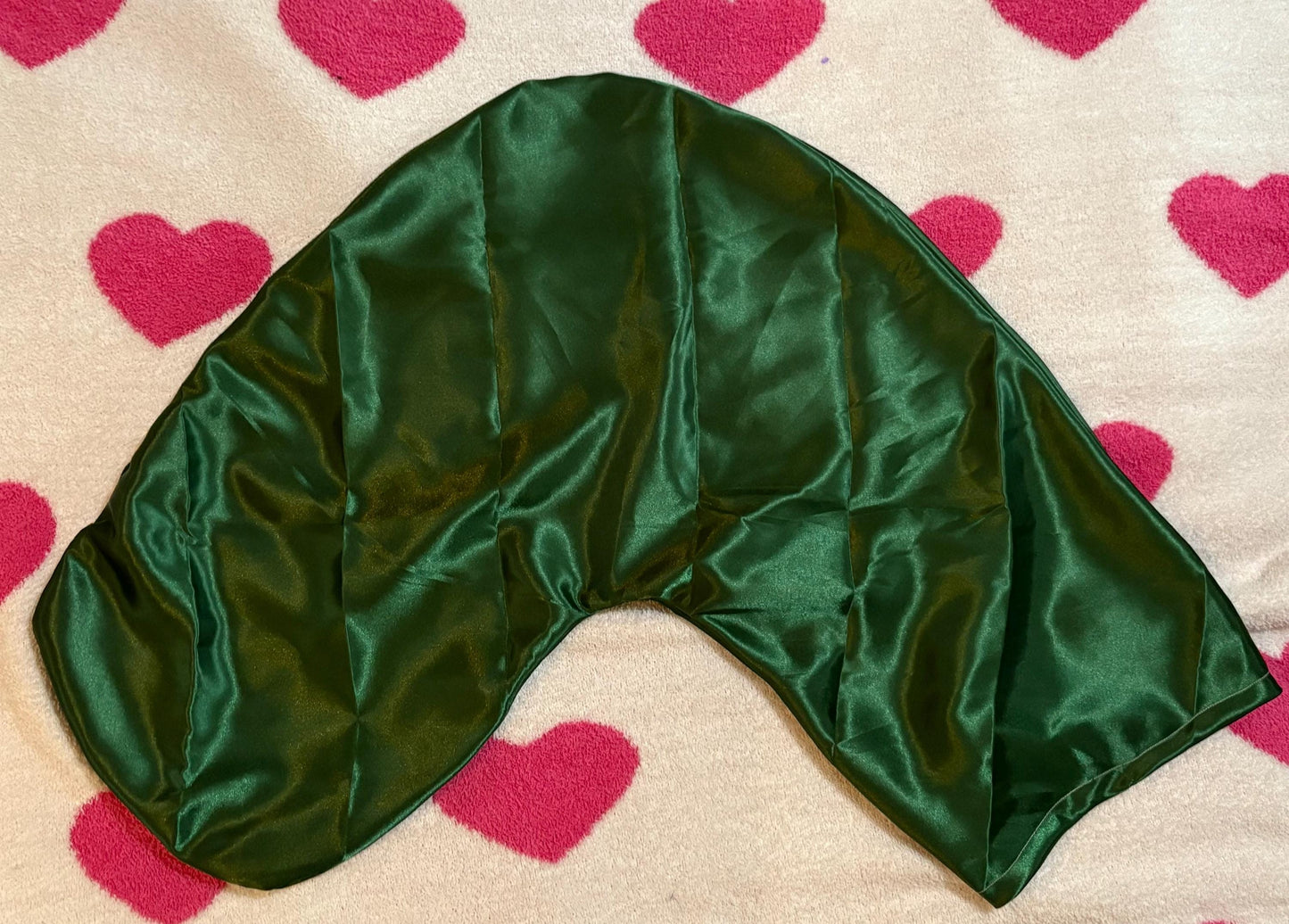 Handmade V-shaped pillowcase in a variety of stylish prints, crafted from soft polyester with a silk satin feel, designed to protect hair and enhance sleep comfort. Pillow not included.