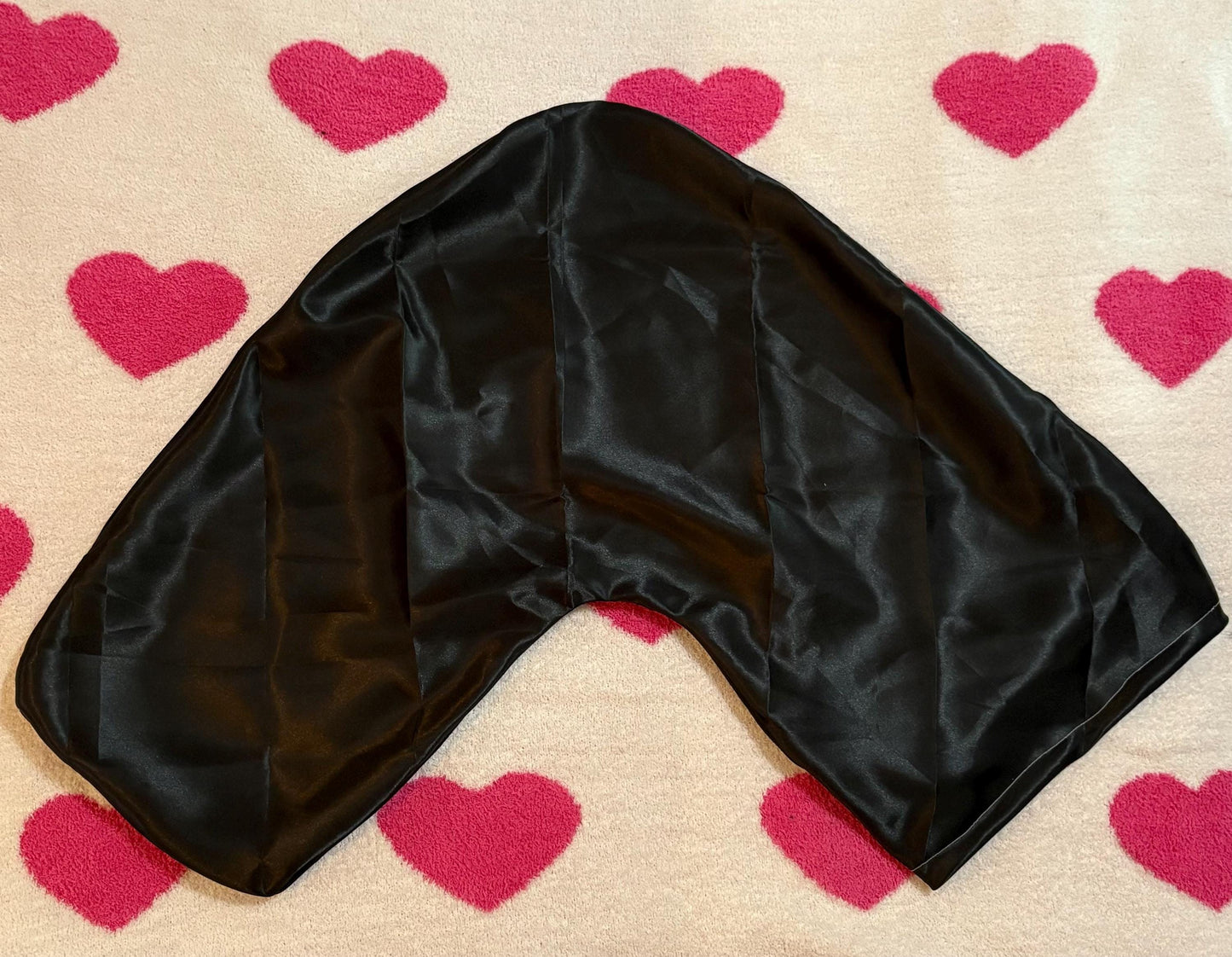 Handmade V-shaped pillowcase in a variety of stylish prints, crafted from soft polyester with a silk satin feel, designed to protect hair and enhance sleep comfort. Pillow not included.