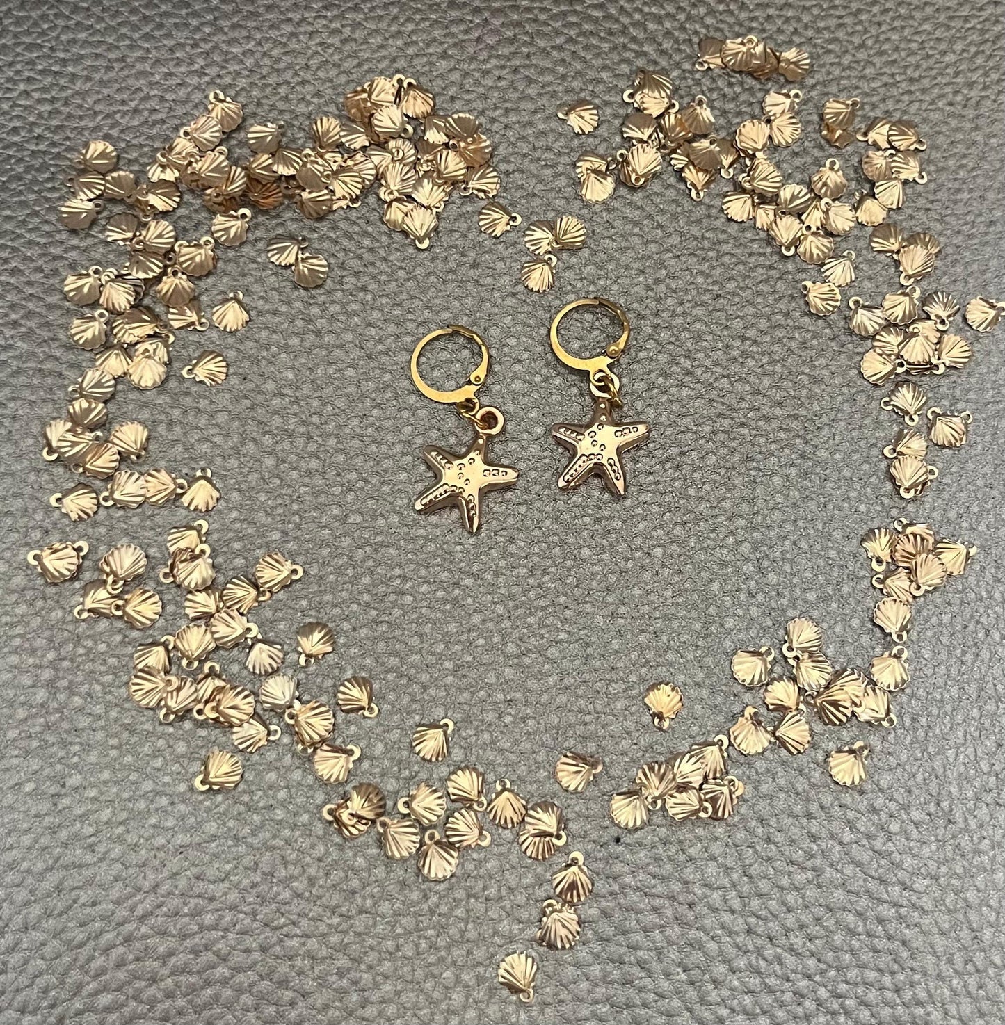 Charming small starfish earrings, ideal for ocean lovers and beach enthusiasts, adding a playful nautical touch to any outfit.