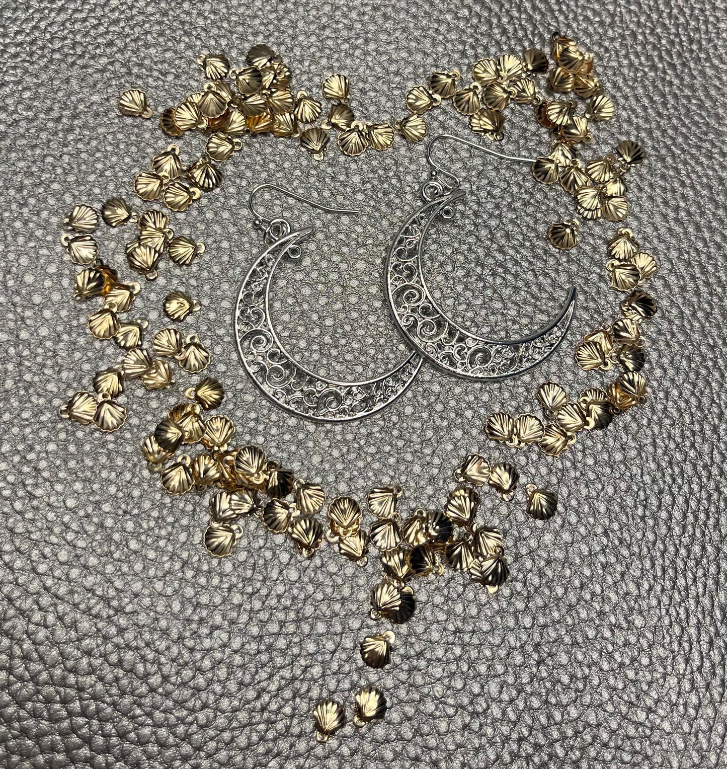Stylish large moon earrings in gold and silver, perfect for adding a celestial touch to your jewelry collection and complementing any outfit.