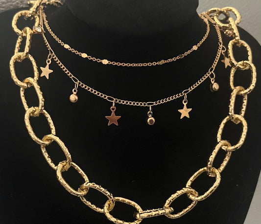 Elegant gold necklace set featuring three versatile necklaces, perfect for layering and enhancing any outfit with a touch of sophistication and style.