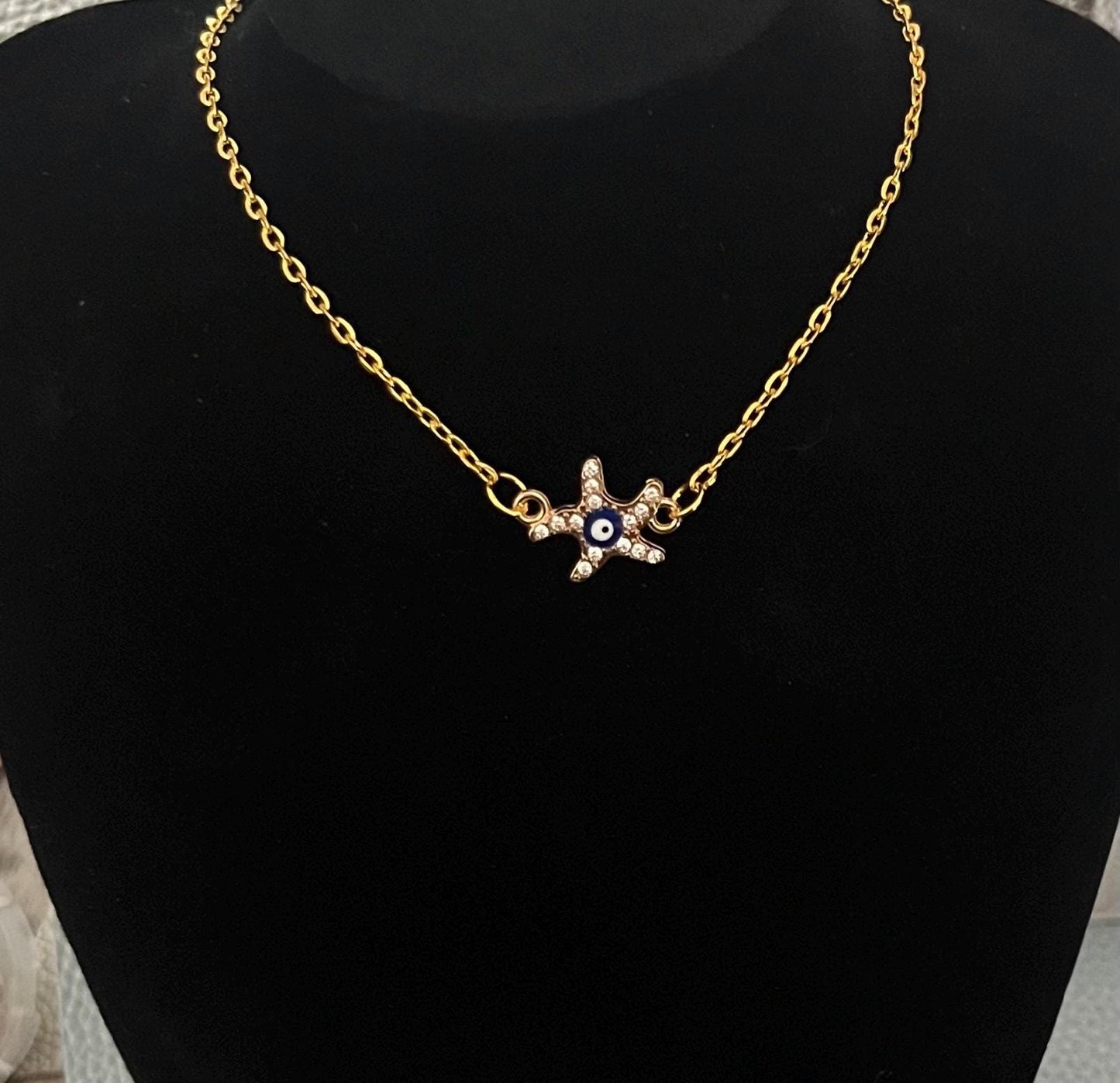 Starfish Diamante Evil Eye Necklace with shimmering crystals, ideal for beach lovers and a stylish accessory to ward off negativity while enhancing any jewelry collection.