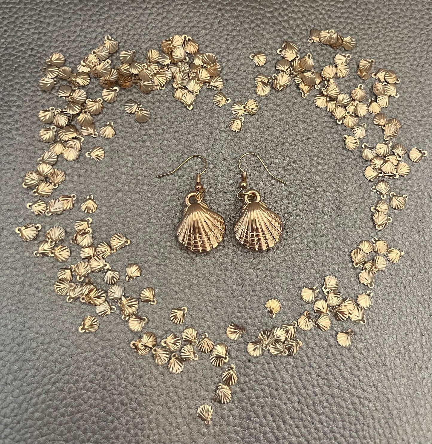 Stylish gold look seashell earrings, perfect for adding a touch of ocean-inspired elegance to your jewelry collection and enhancing any summer outfit.