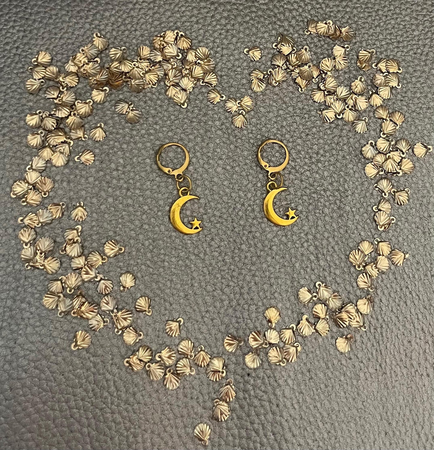 Adorable small moon and star earrings, featuring a charming celestial design perfect for everyday wear, adding a touch of whimsy and sparkle to any outfit