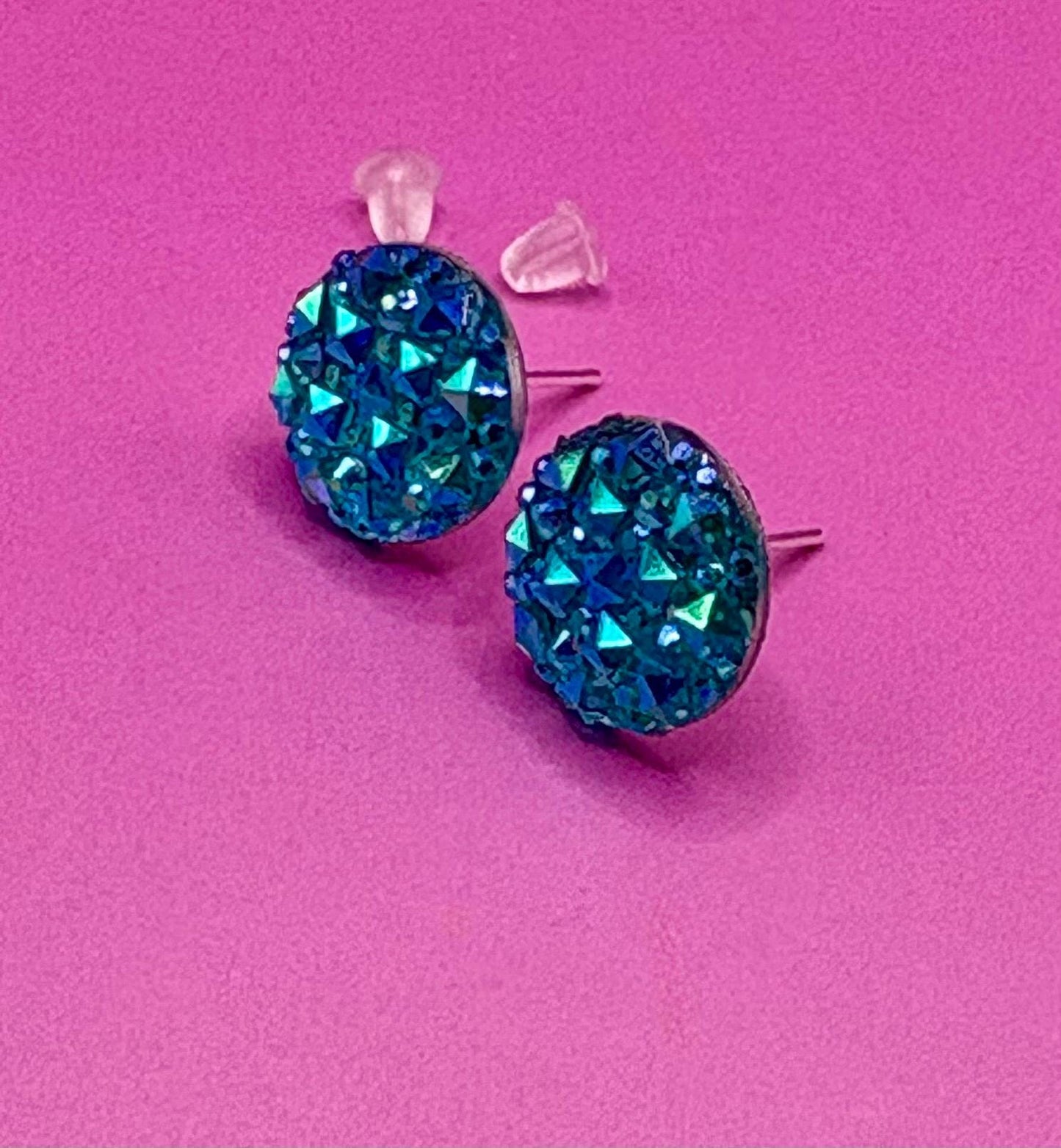 Beautiful dazzling blue stud earrings with sparkling crystals, perfect for adding a pop of color and elegance to any outfit.