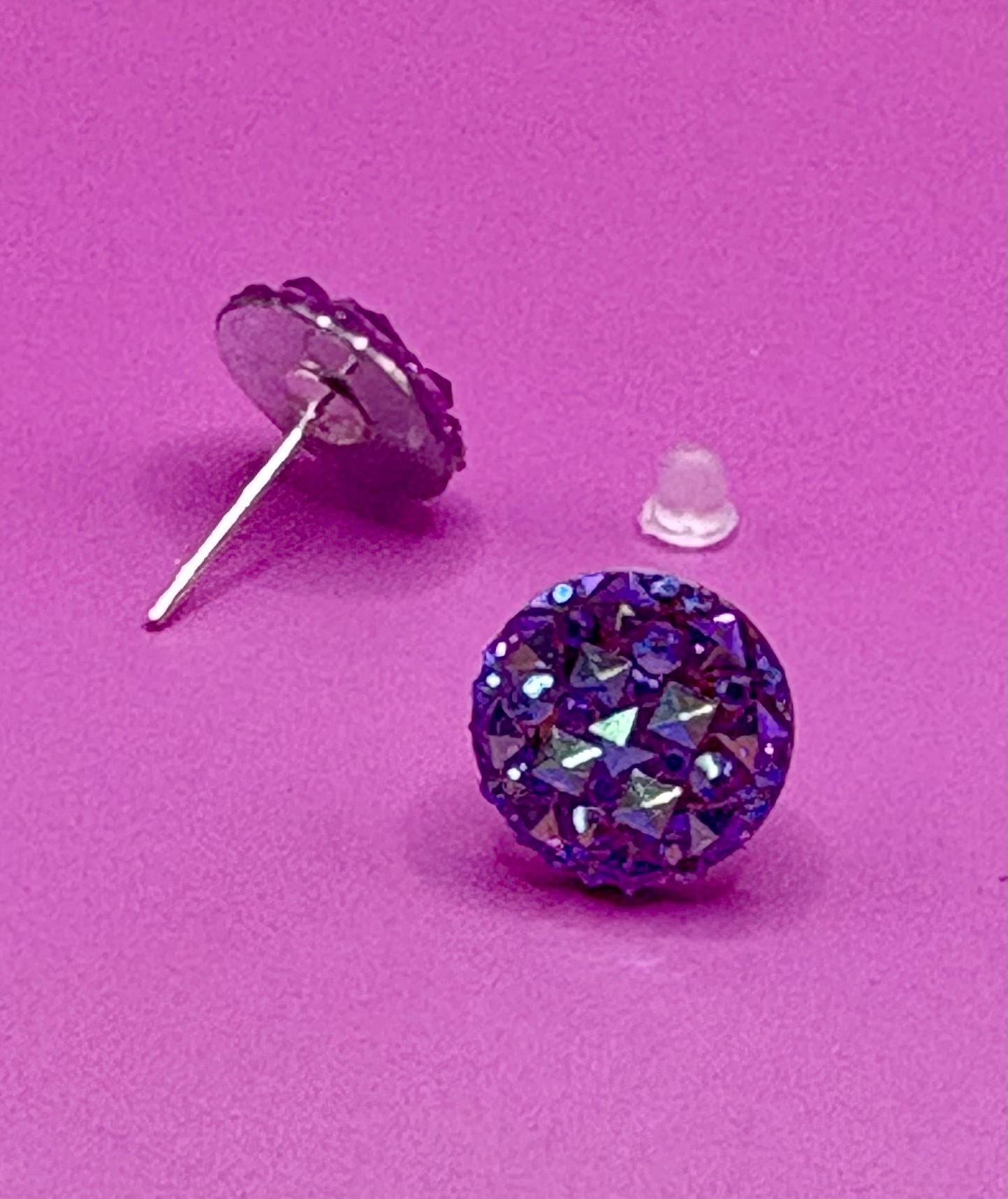 Dazzling purple stud earrings with sparkling gemstones, perfect for adding a touch of elegance to any outfit and enhancing your jewelry collection.