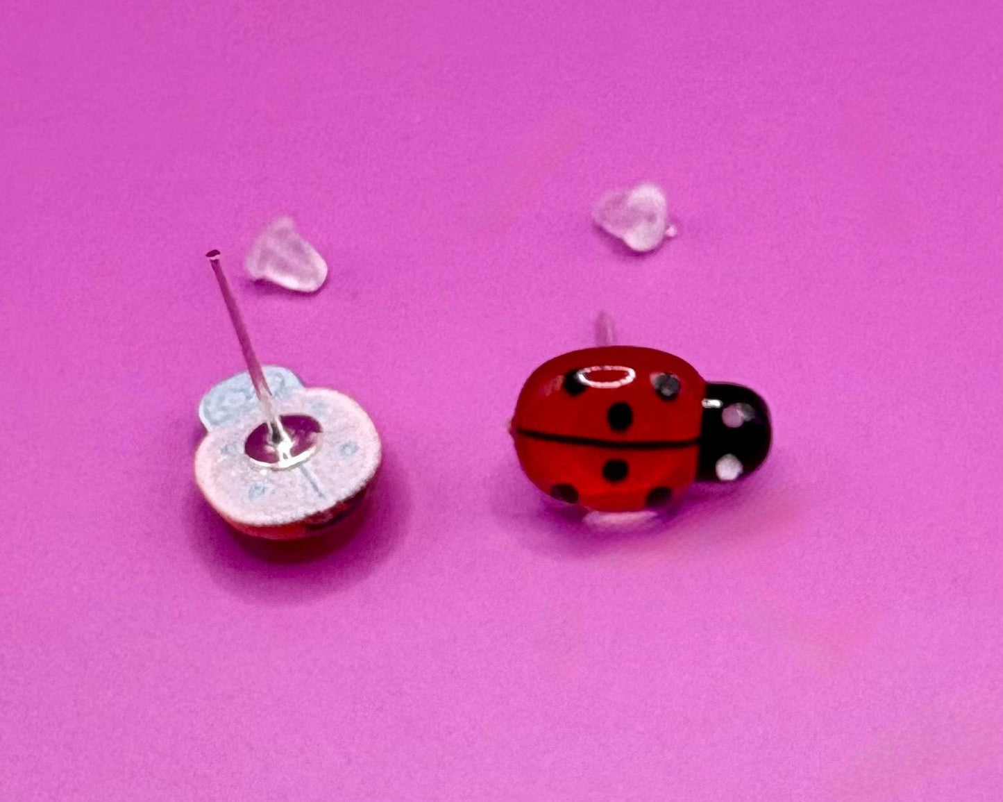 Whimsical red ladybug earrings with charming design, perfect for adding a playful touch to your outfit and ideal for nature lovers and casual wear.