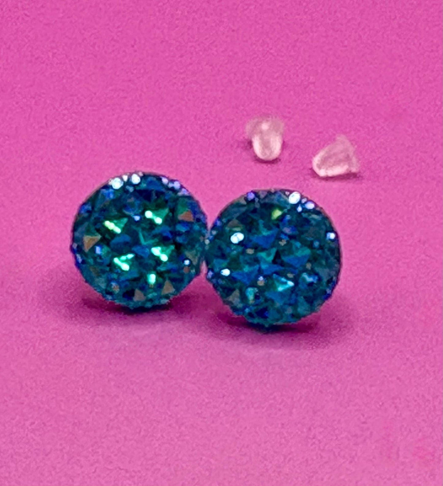 Beautiful dazzling blue stud earrings with sparkling crystals, perfect for adding a pop of color and elegance to any outfit.