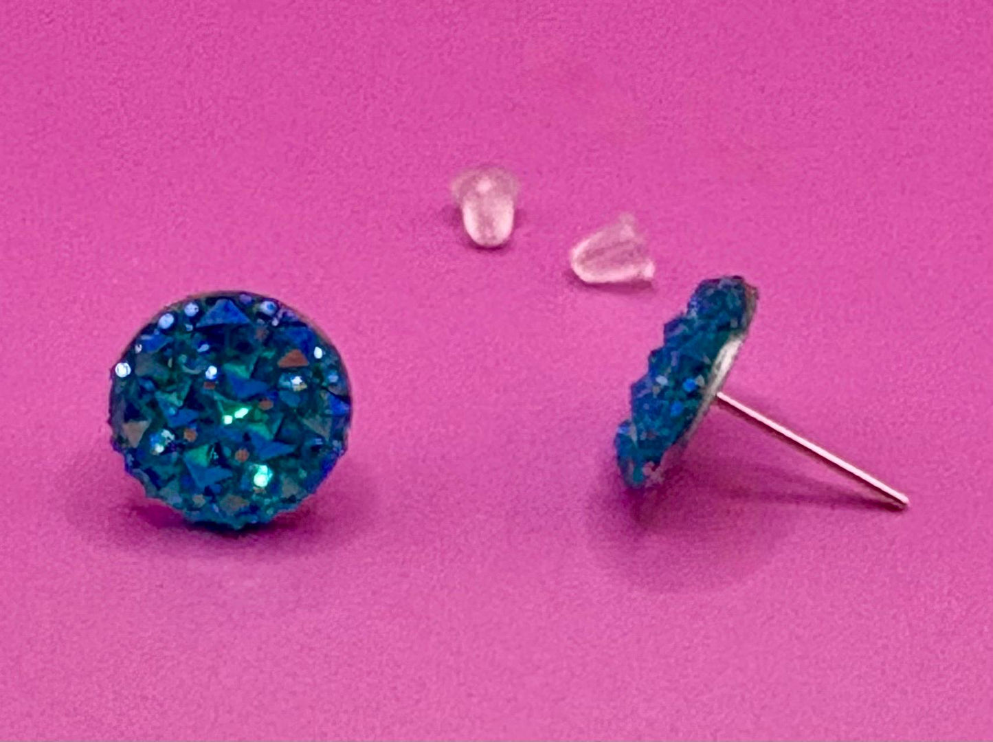 Beautiful dazzling blue stud earrings with sparkling crystals, perfect for adding a pop of color and elegance to any outfit.