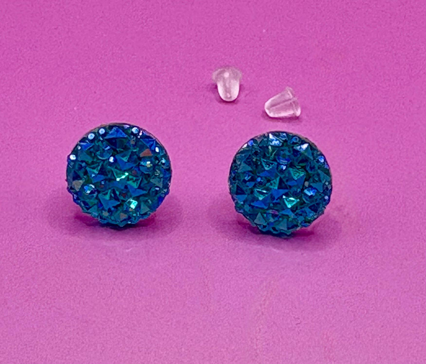Beautiful dazzling blue stud earrings with sparkling crystals, perfect for adding a pop of color and elegance to any outfit.