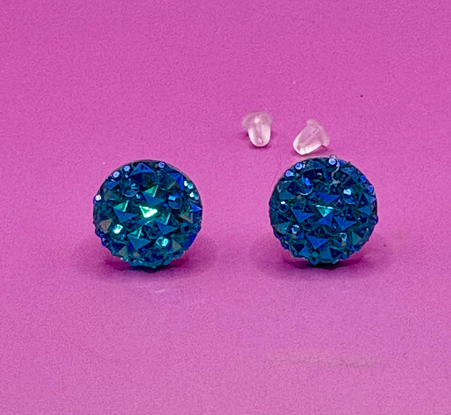 Beautiful dazzling blue stud earrings with sparkling crystals, perfect for adding a pop of color and elegance to any outfit.