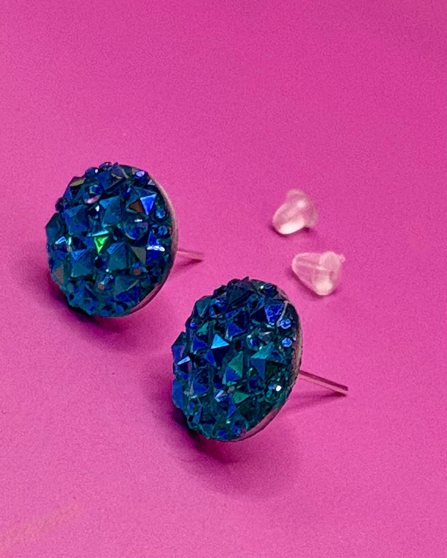 Beautiful dazzling blue stud earrings with sparkling crystals, perfect for adding a pop of color and elegance to any outfit.