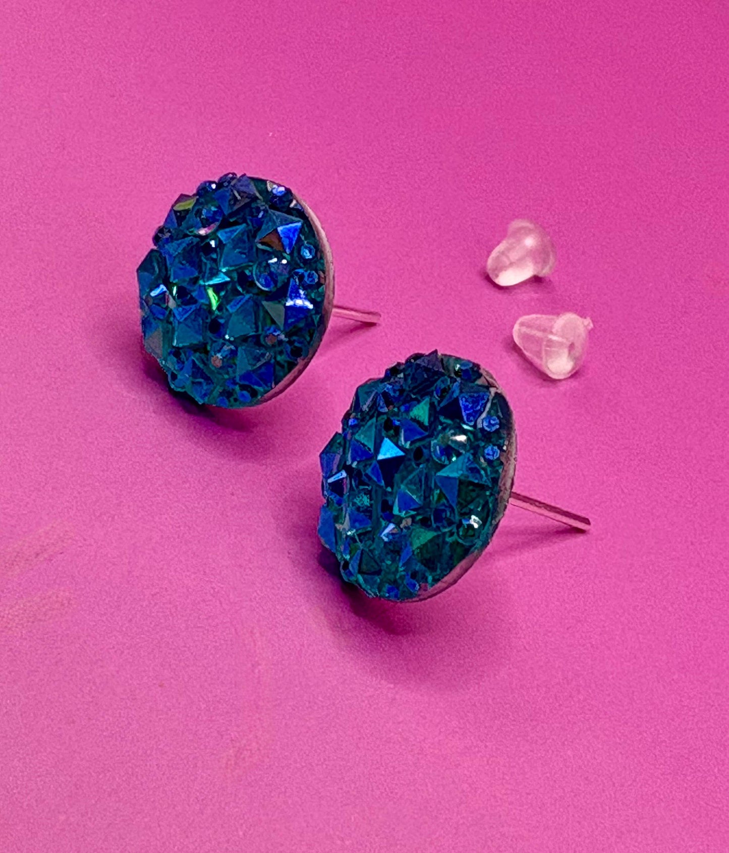 Beautiful dazzling blue stud earrings with sparkling crystals, perfect for adding a pop of color and elegance to any outfit.