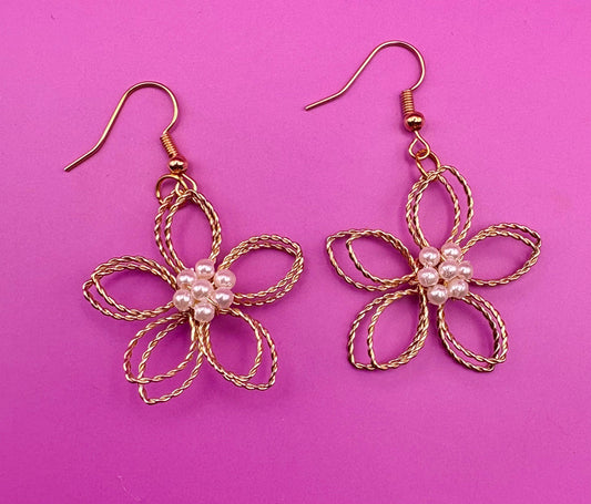 Gold look flower pearly centre dangly earrings