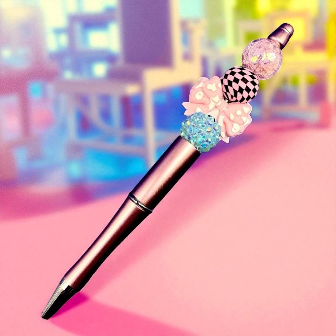 black ballpoint pen with colourful bead accents. stationery lovers Leopard print hearts and bows.
