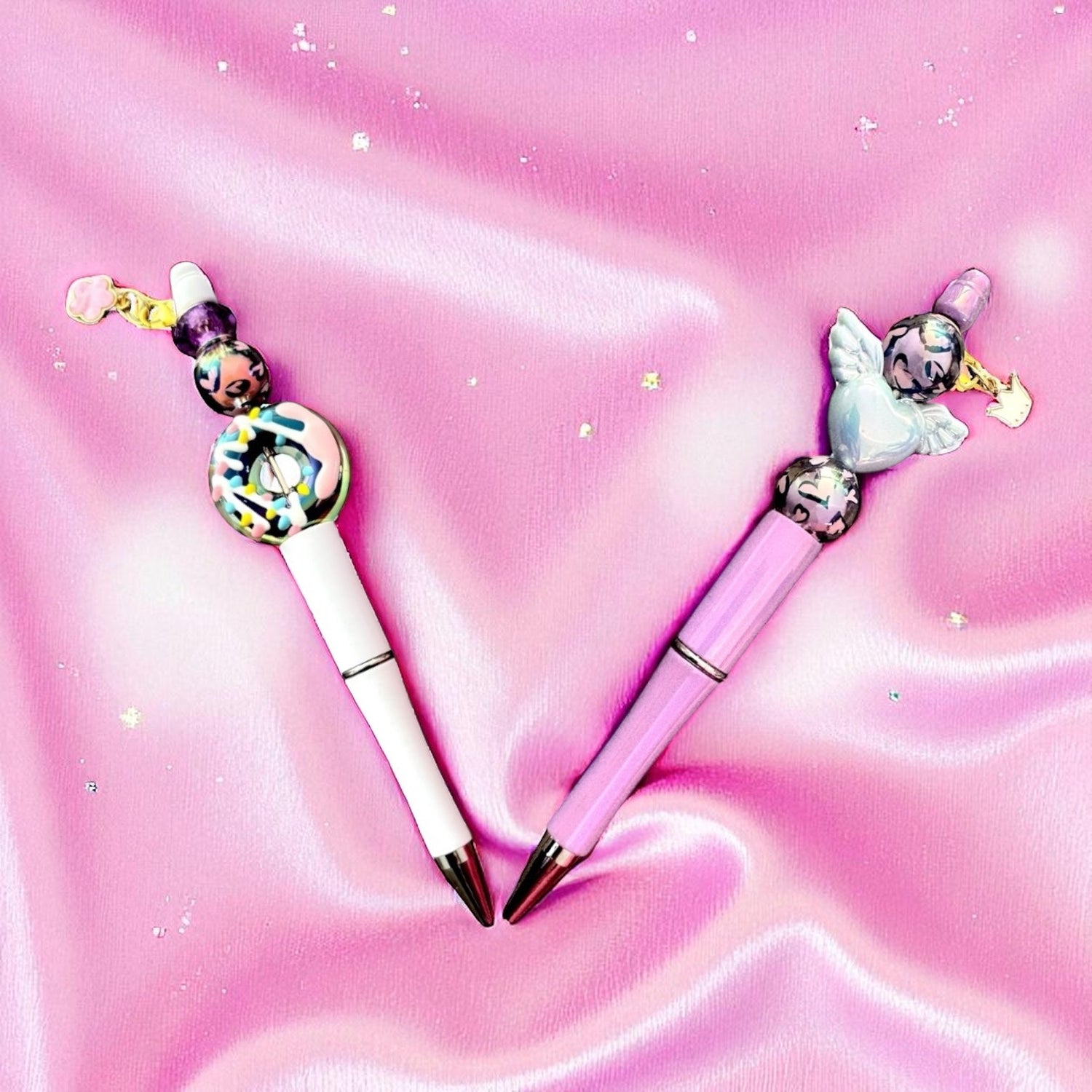 bespoke fun donut pen with charm, angel wings with leopard print beads and crown charm