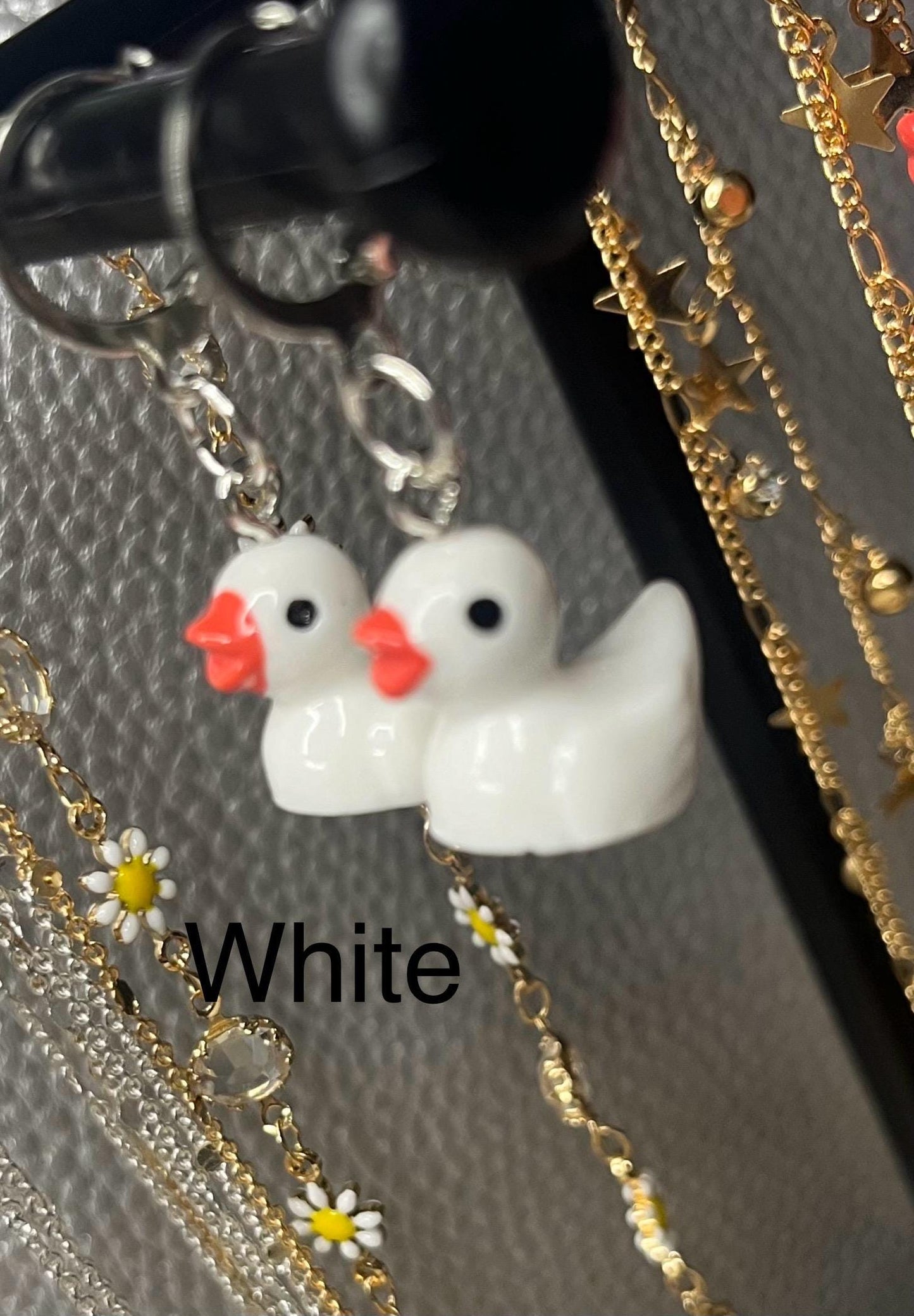 Cute little rubber duck style earrings, dangly drop earrings. available in multiple colours. pink blue yellow purple white costume jewellery