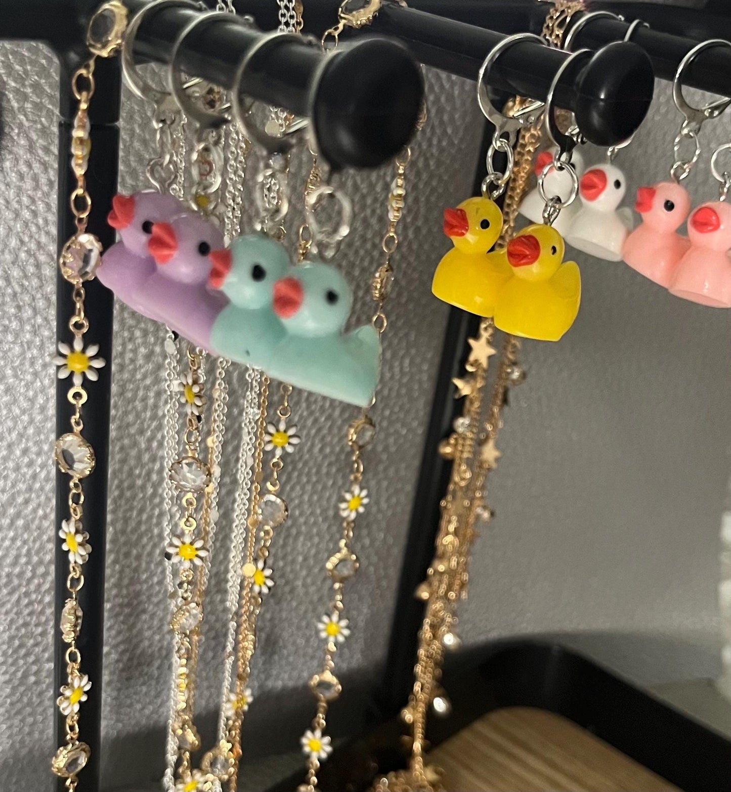 Cute little rubber duck style earrings, dangly drop earrings. available in multiple colours. pink blue yellow purple white costume jewellery