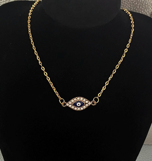 Gold Diamante Evil Eye Pendant Necklace adorned with sparkling crystals, symbolizing protection and style, perfect for layering or as a statement piece.